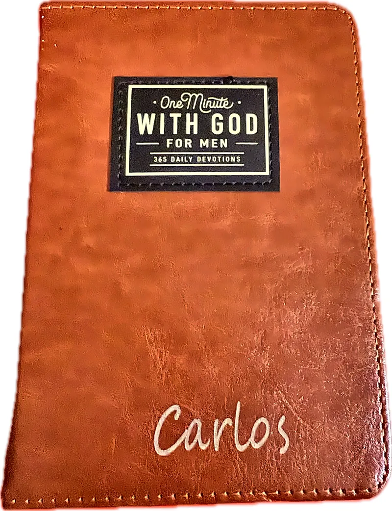 Brown faux-leather devotional book cover with the name Carlos in light script lettering near the bottom